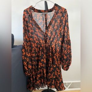 Long sleeve black dress with orange floral pattern